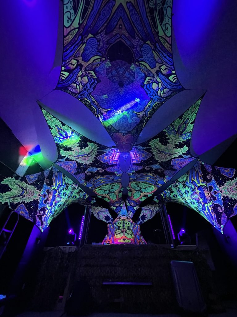 UV-Canopy and a DJ-Stage built from UV-Petals by Visual Tribe