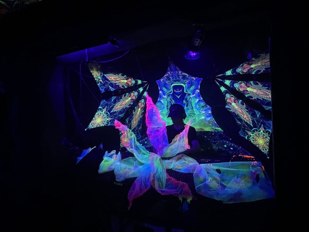 UV-Canopy and a DJ-Stage built from UV-Petals by Visual Tribe